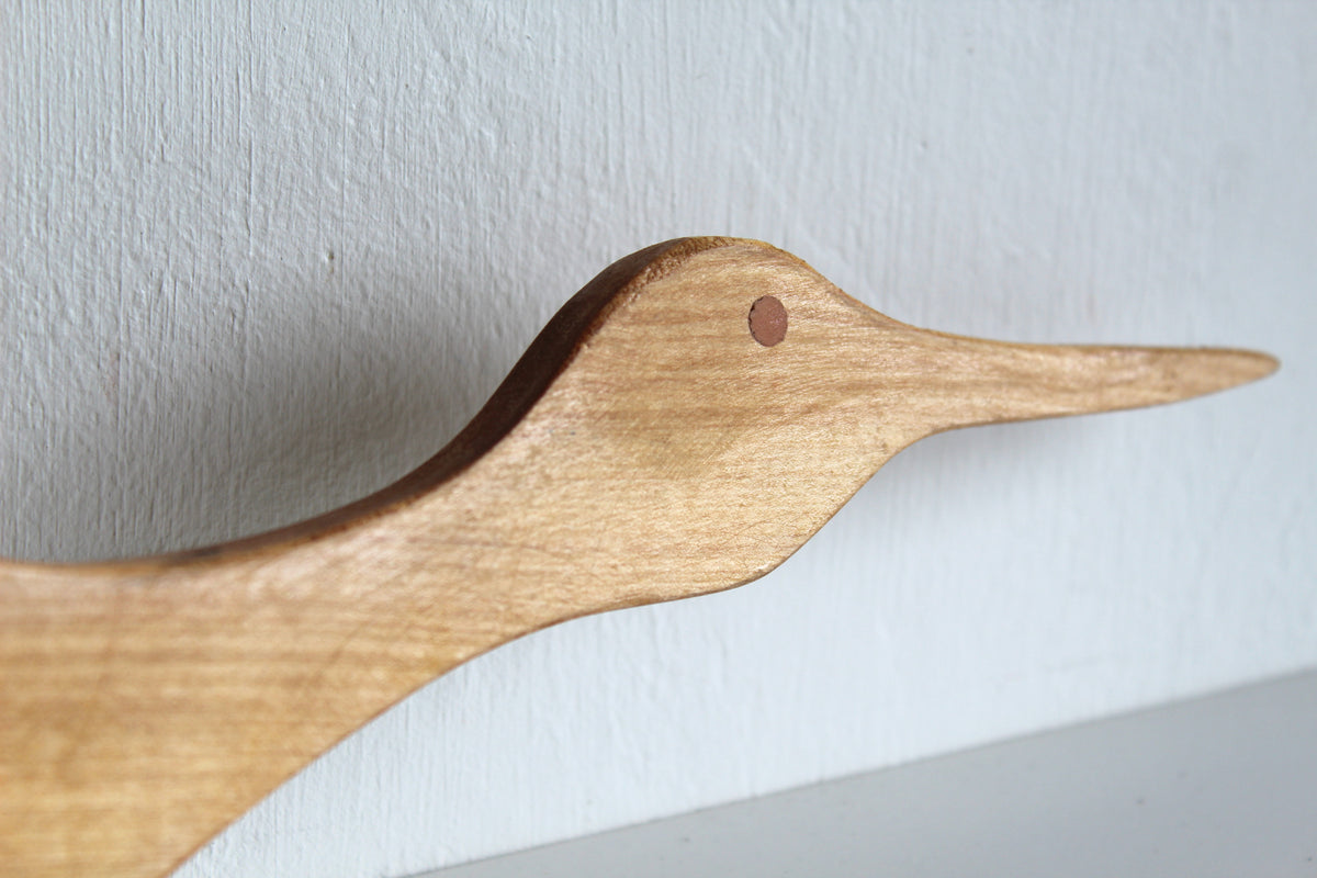 Pájaro decorativo articulado de madera de Raulí